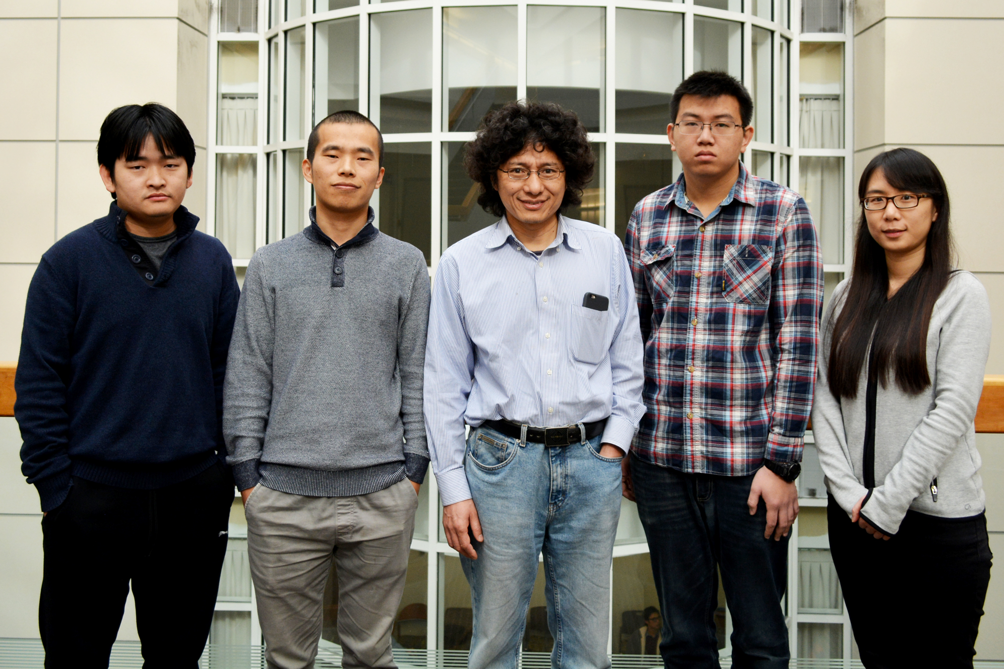 (Left to right) Ruyi Zhu, Qing-Feng Wu (first author), Jin-Quan Yu (senior author), Peng-Xiang Shen and Qian Shao were among the study authors at The Scripps Research Institute. (Photo by Madeline McCurry-Schmidt.)